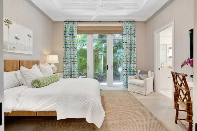 a bathroom with a toilet sink vanity and mirror