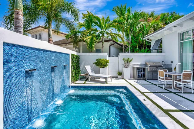 a view of a backyard with plants and a patio