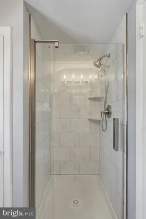 a view of a room with wooden floor and window