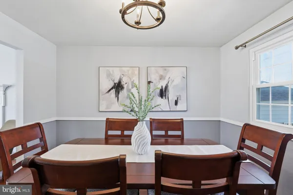 a view of a dining room with furniture and window