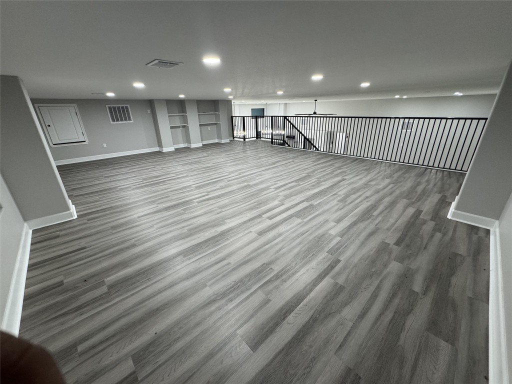 4926 West Old Lockhart Road Muldoon, TX 78949 - Photo 9 of 19 a view of an empty room with wooden floor