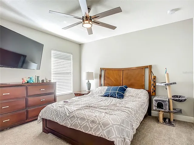 a bedroom with a bed and window