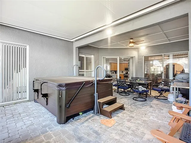 a view of a livingroom with furniture and a window