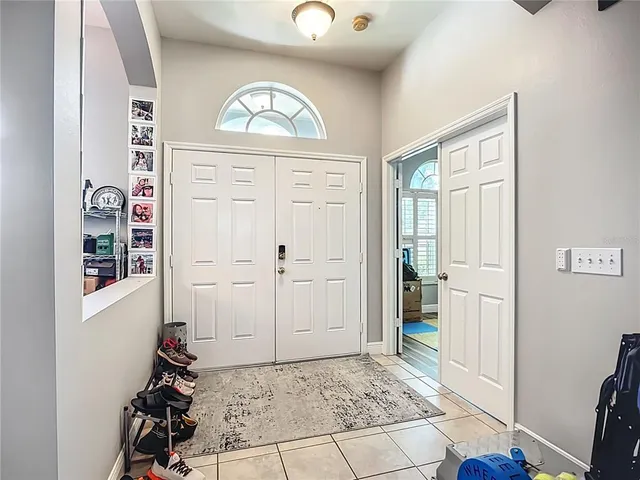a view of an entryway with wooden floor