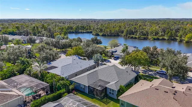 an aerial view of a house with a lake view