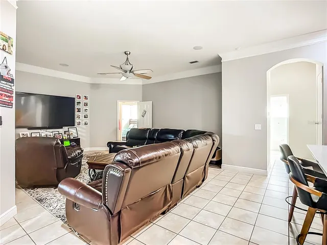 a room with furniture and a flat screen tv