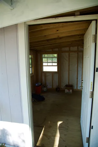 a view of a room that has a bed