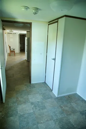 an empty room with a mirror