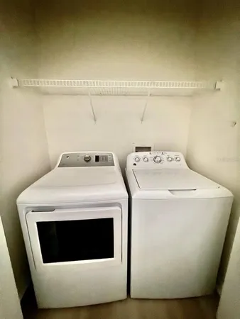 a utility room with dryer and washer