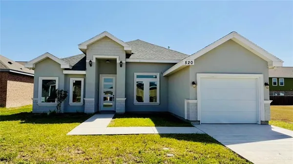a view of a house with large swimming pool and sitting area