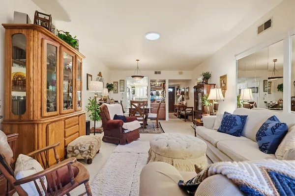 a kitchen with cabinets and wooden floor