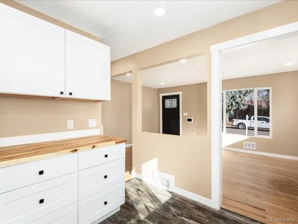 a view of kitchen with wooden floor