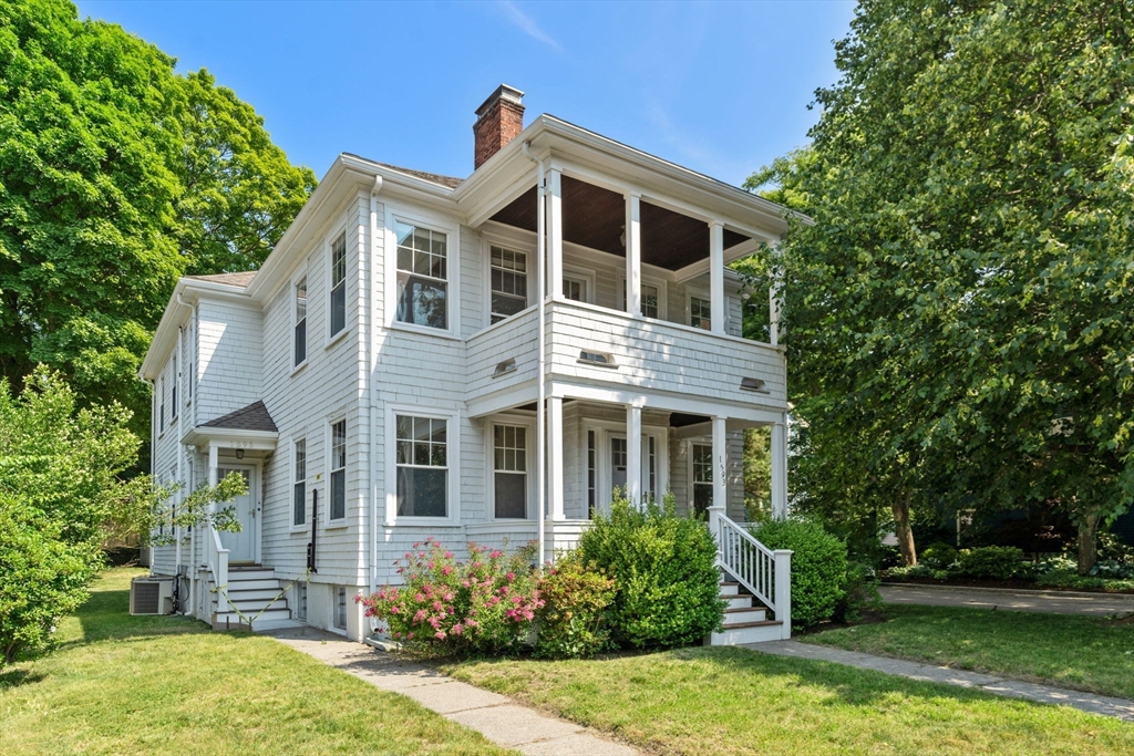 1595 Centre Street, Unit 2 Newton, MA 02461 - Photo 1 of 1 a front view of a house with garden