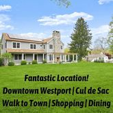 a sign broad in front of a white house