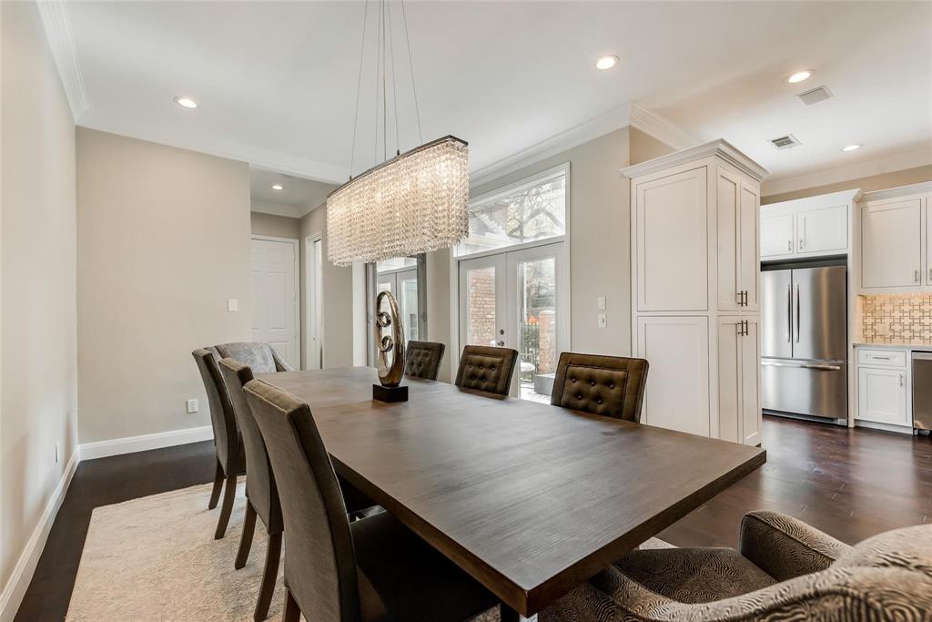 2902 North Pearl Street Dallas, TX 75201 - Photo 17 of 36 Dining room featuring ornamental molding and dark wood finished floors