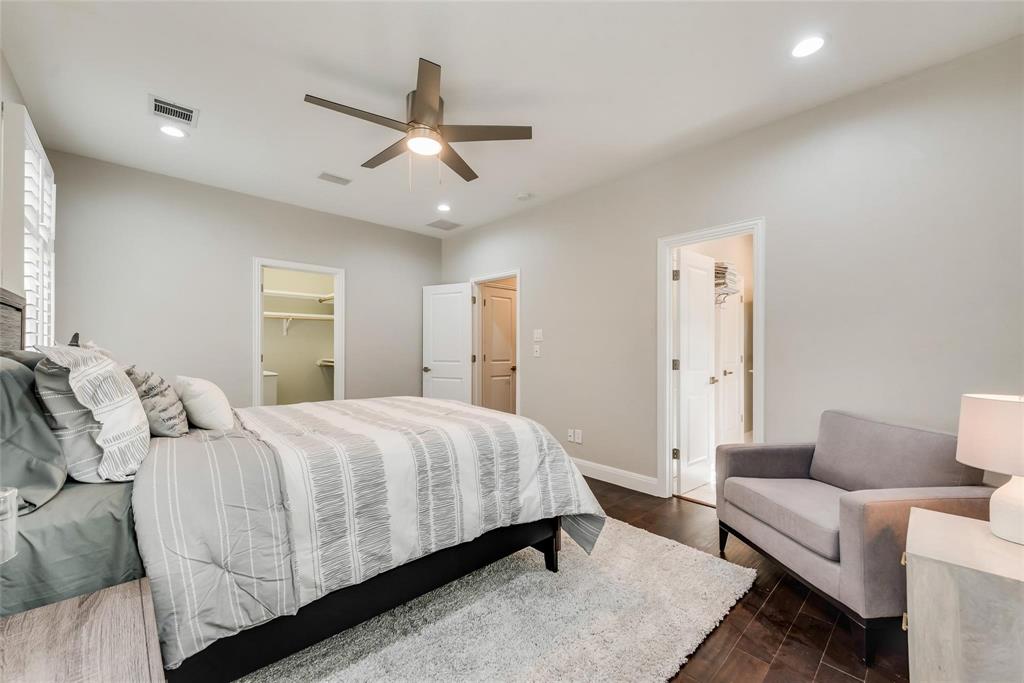 2902 North Pearl Street Dallas, TX 75201 - Photo 22 of 36 Bedroom featuring a walk in closet, dark wood-type flooring, baseboards, visible vents, and recessed lighting