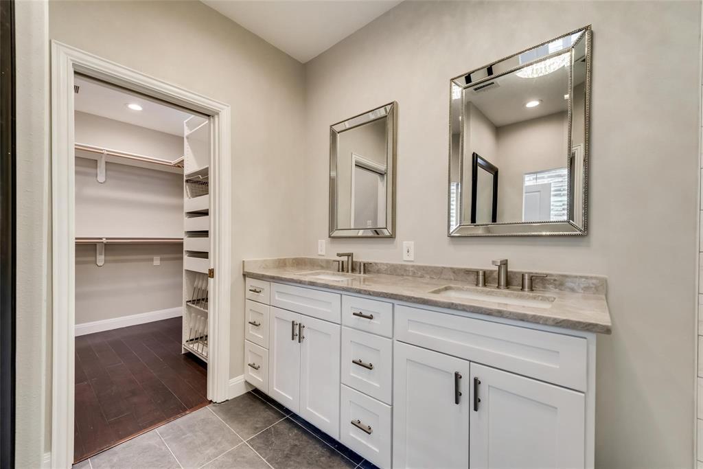 2902 North Pearl Street Dallas, TX 75201 - Photo 33 of 36 Bathroom featuring double vanity, a walk in closet, tile patterned flooring, and a sink