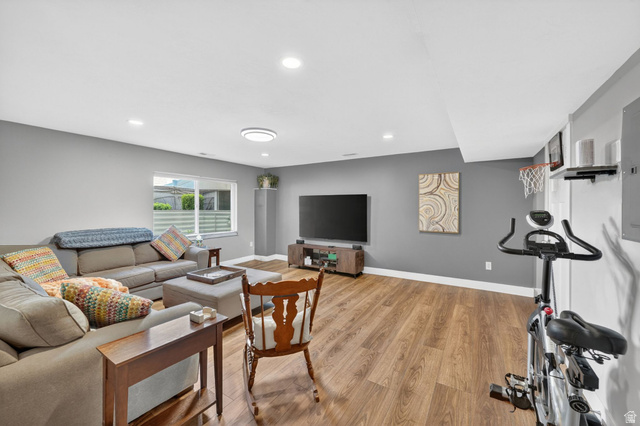 7872 Farm House Lane Midvale, UT 84047 - Photo 27 of 39 Spacious room featuring wood-finish flooring, recessed lighting, and a window providing natural illumination