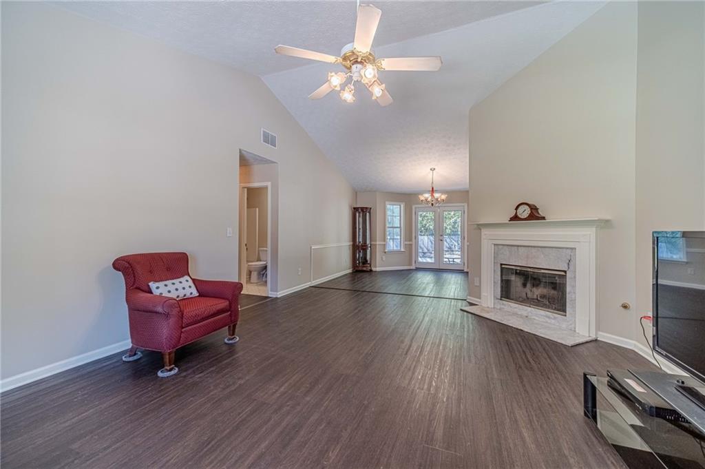 309 Magnolia Lane Monroe, GA 30655 - Photo 12 of 25 a living room with furniture and a fireplace