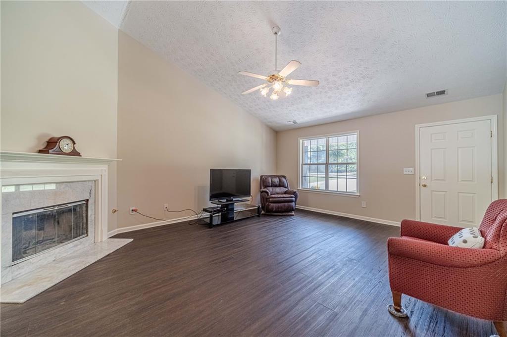 309 Magnolia Lane Monroe, GA 30655 - Photo 13 of 25 a view of a livingroom with furniture and a fireplace