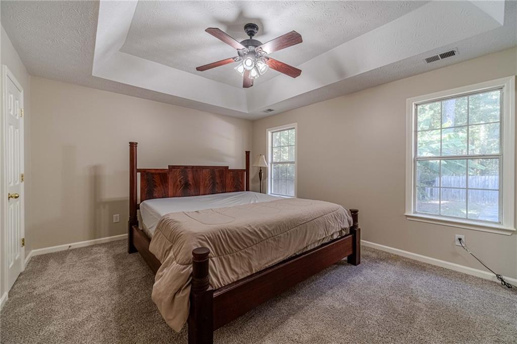 309 Magnolia Lane Monroe, GA 30655 - Photo 21 of 25 a bedroom with a bed and window