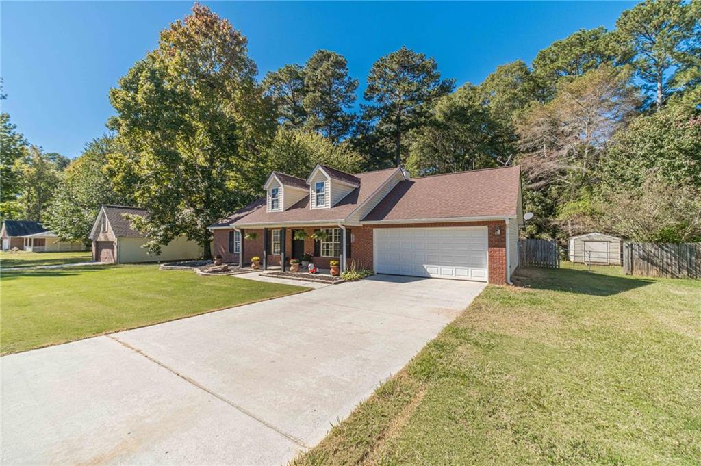 309 Magnolia Lane Monroe, GA 30655 - Photo 8 of 25 front view of a house with a yard