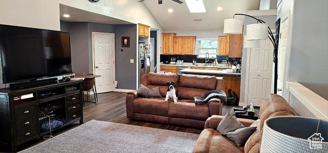 2269 Clear Creek Road Nibley, UT 84321 - Photo 8 of 27 Living area with recessed lighting, dark wood finished floors, vaulted ceiling, and a skylight