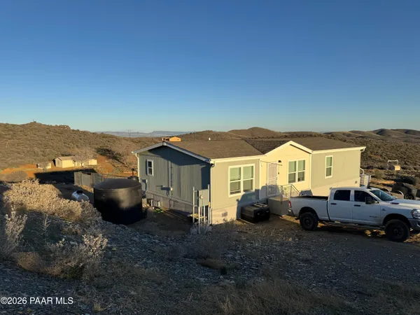 a view of a car parked in front of a house