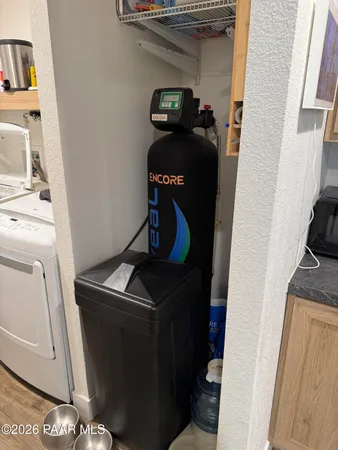 a view of storage and utility room with washer and dryer