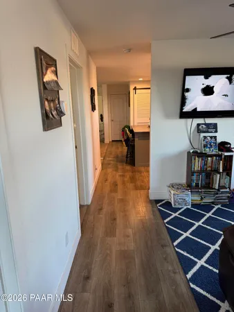 a room with wooden floor and furniture