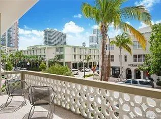 a view of balcony with a potted plant and palm trees