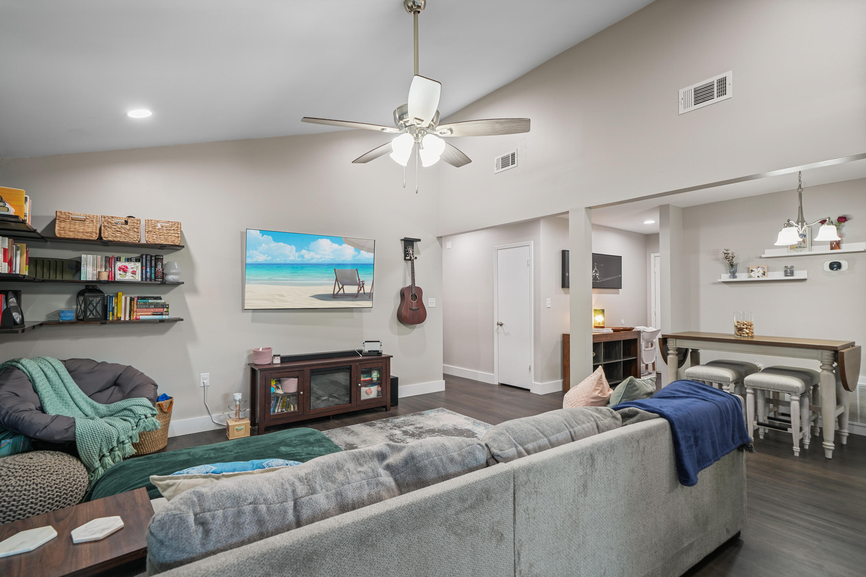 39 9th Street Shalimar, FL 32579 - Photo 11 of 37 a living room with furniture a ceiling fan and a bookshelf