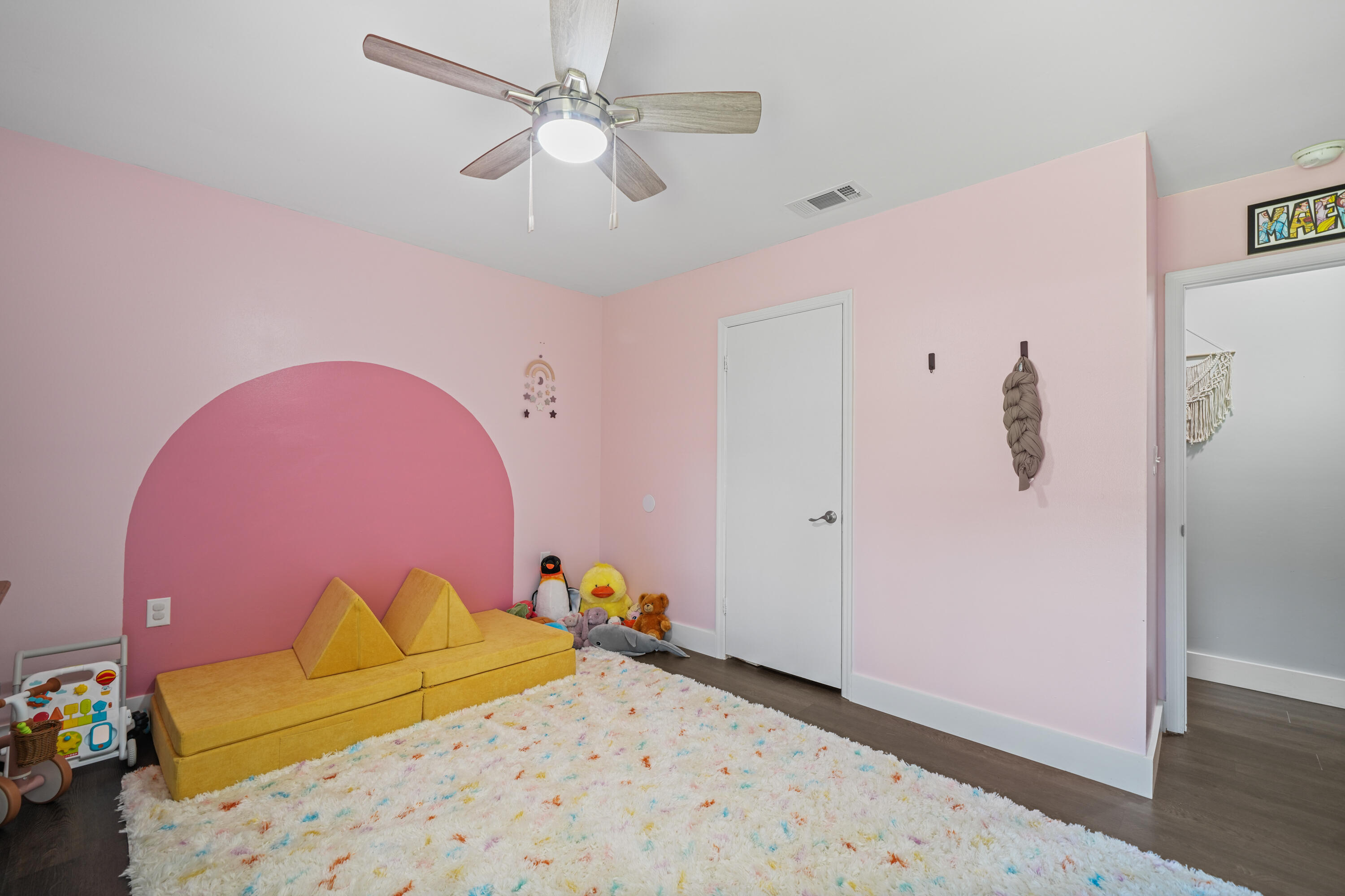 39 9th Street Shalimar, FL 32579 - Photo 17 of 37 a bedroom with a bed and a chandelier