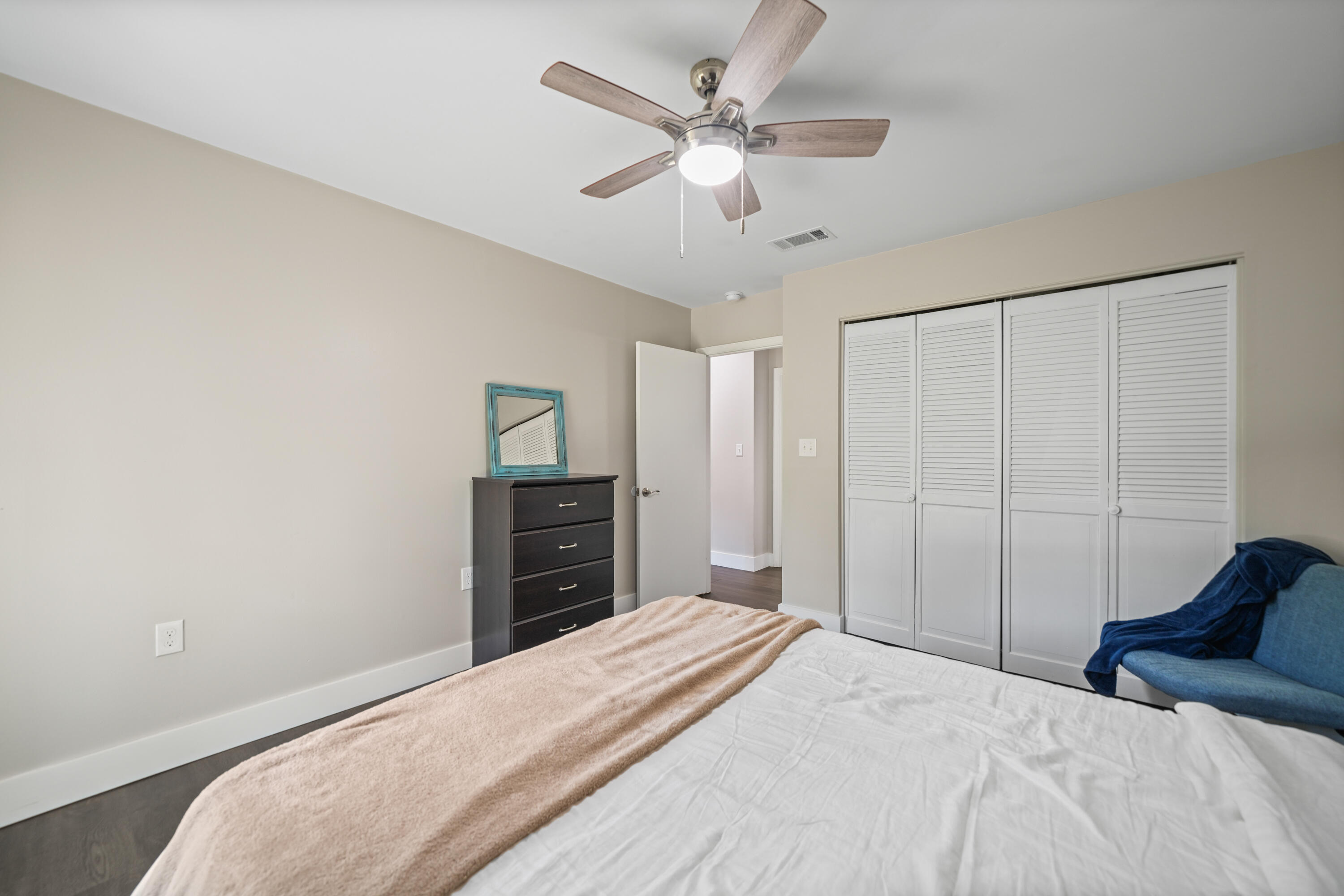 39 9th Street Shalimar, FL 32579 - Photo 20 of 37 a bedroom with a bed and a chandelier