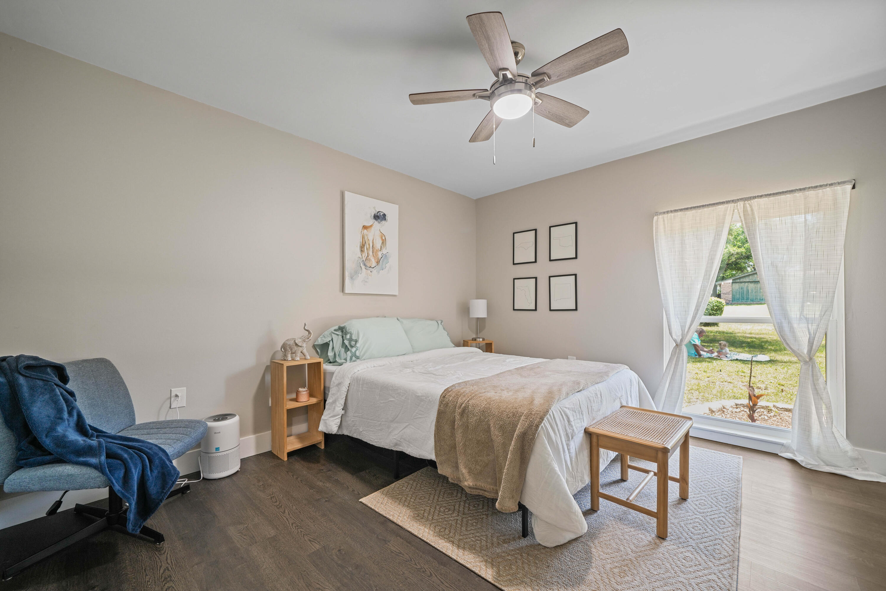 39 9th Street Shalimar, FL 32579 - Photo 22 of 37 a bedroom with a bed a couch and a window