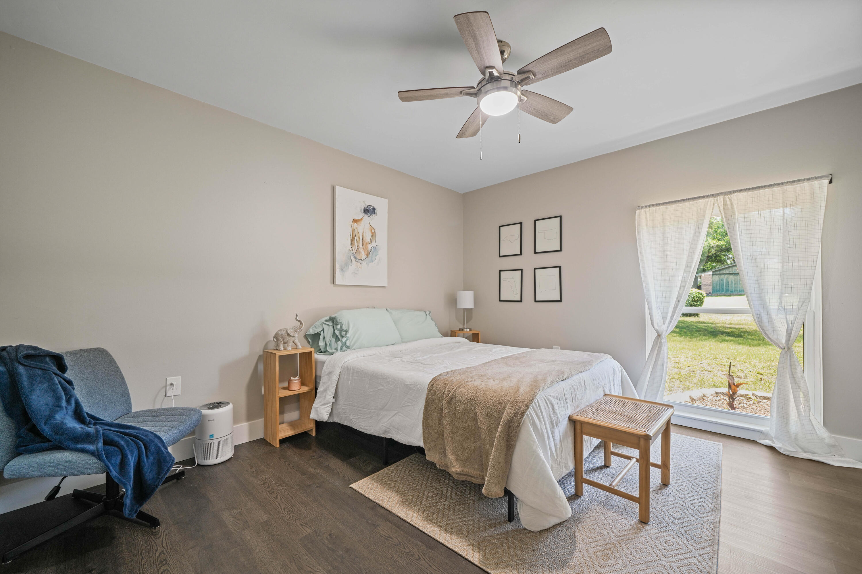 39 9th Street Shalimar, FL 32579 - Photo 23 of 37 a bedroom with a bed a couch and a window