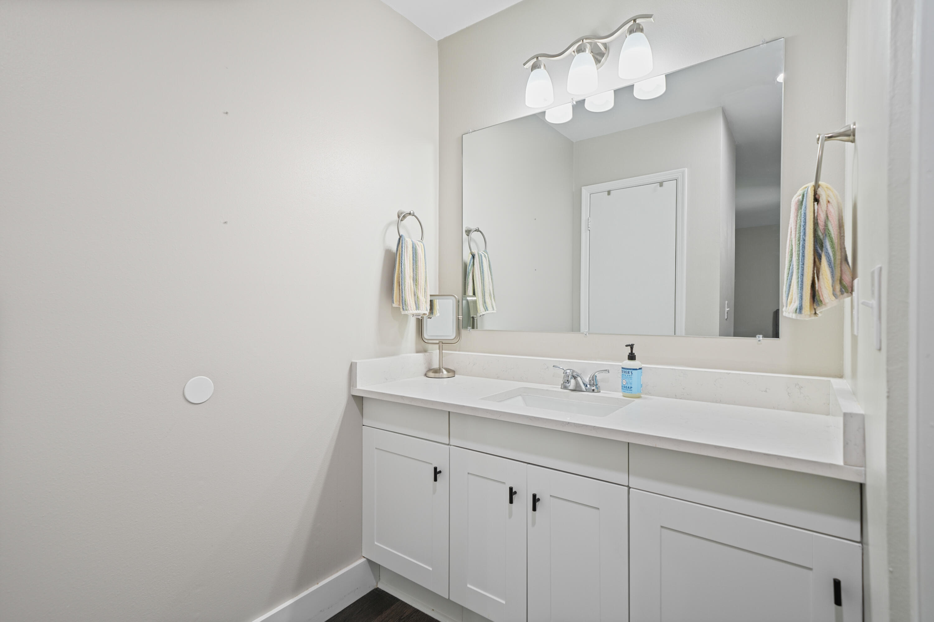 39 9th Street Shalimar, FL 32579 - Photo 27 of 37 a bathroom with a sink and a mirror
