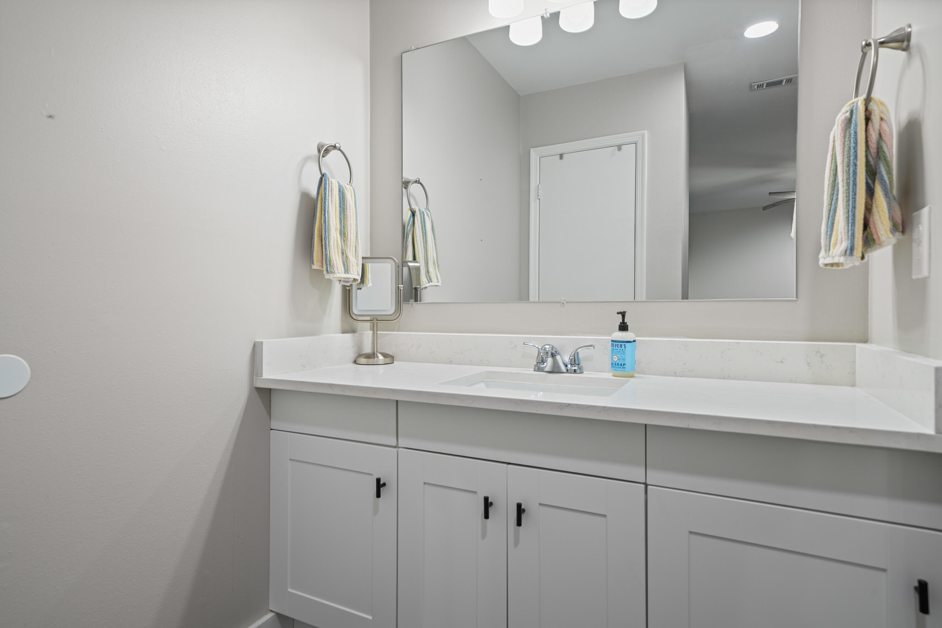 39 9th Street Shalimar, FL 32579 - Photo 29 of 37 a bathroom with a sink and a mirror