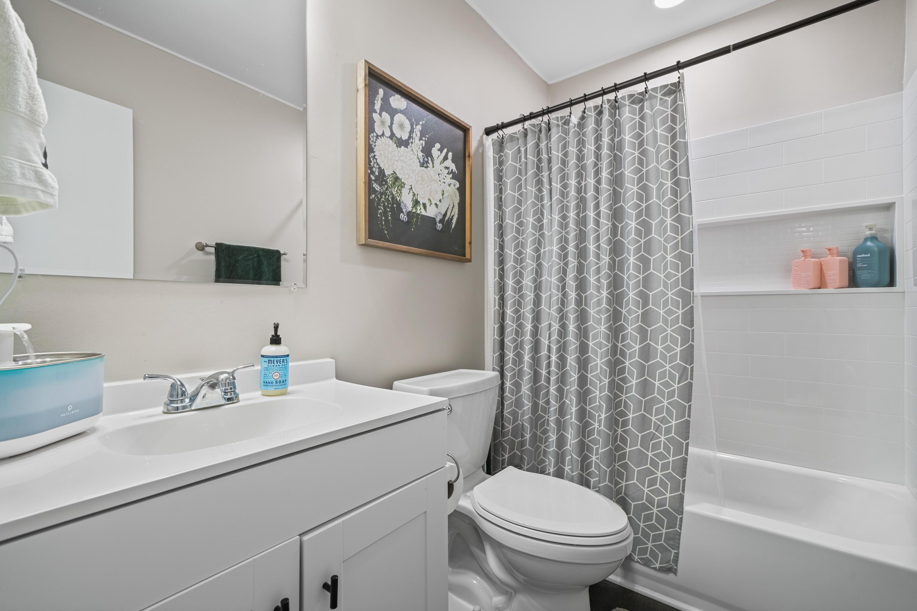 39 9th Street Shalimar, FL 32579 - Photo 31 of 37 a bathroom with a sink a toilet and a mirror