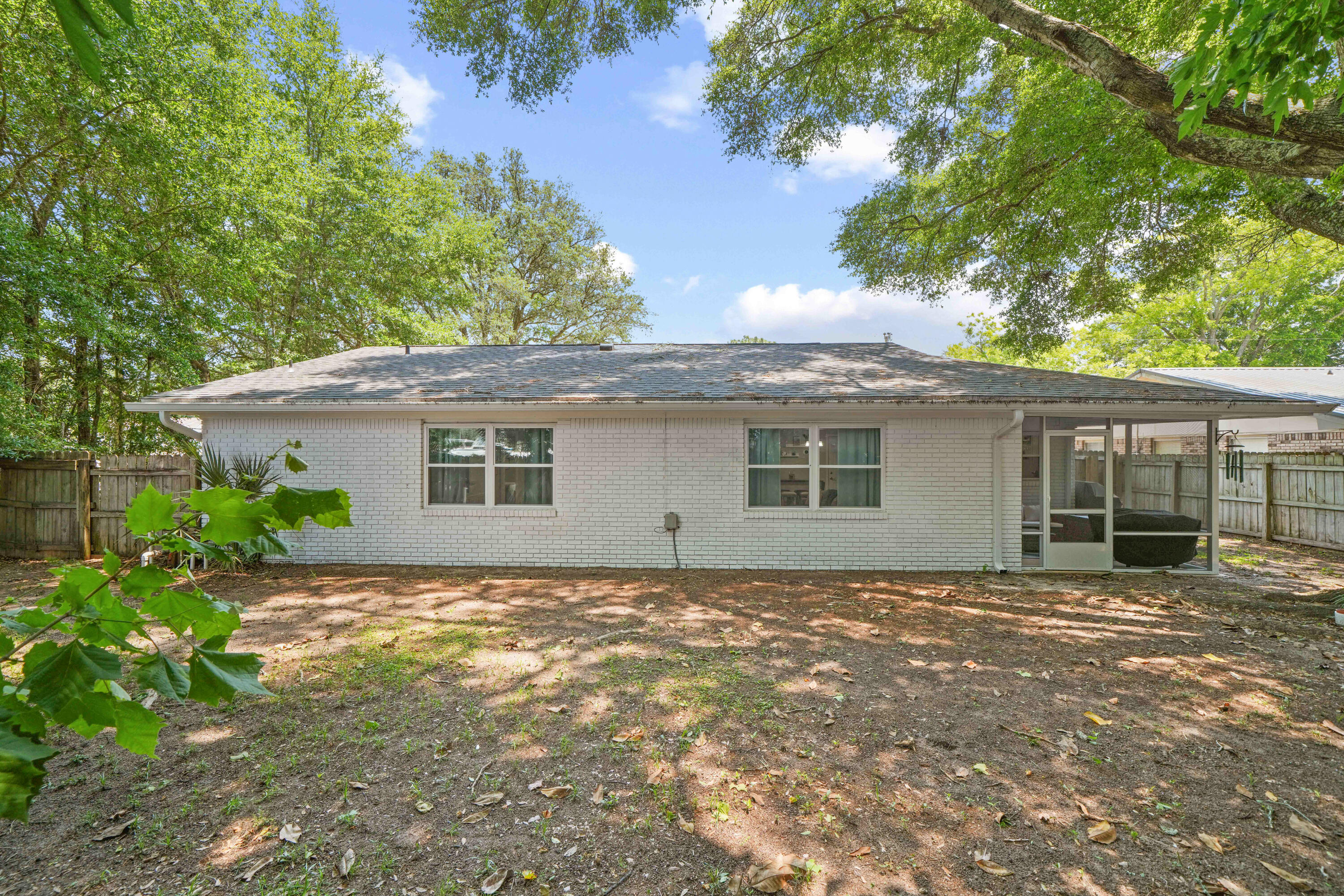 39 9th Street Shalimar, FL 32579 - Photo 33 of 37 a view of a house with a garden