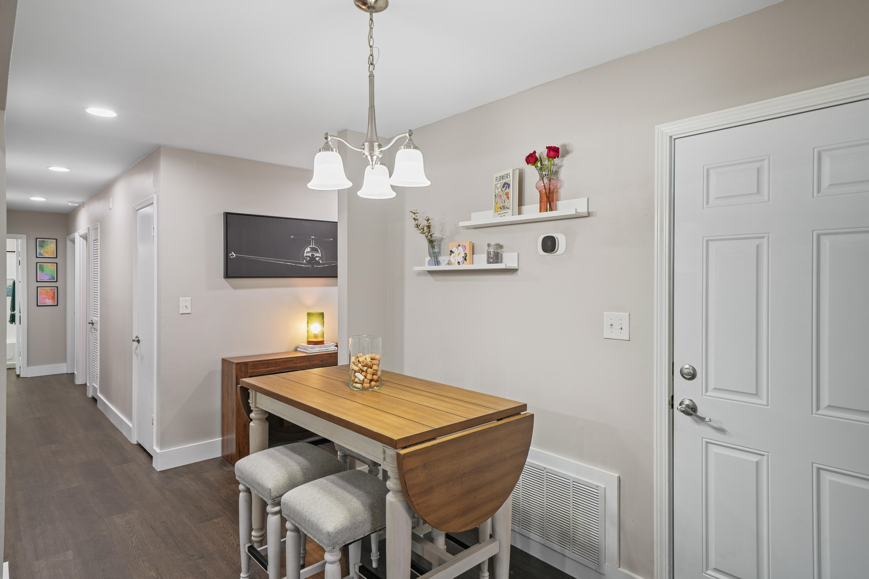 39 9th Street Shalimar, FL 32579 - Photo 10 of 37 a view of a dining room with furniture and a chandelier