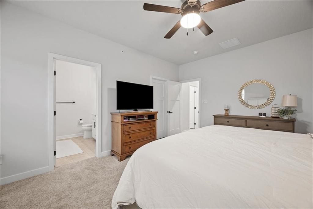 9004 Hickory Road Gibsonia, PA 15044 - Photo 27 of 37 a bedroom with a bed and a flat screen tv