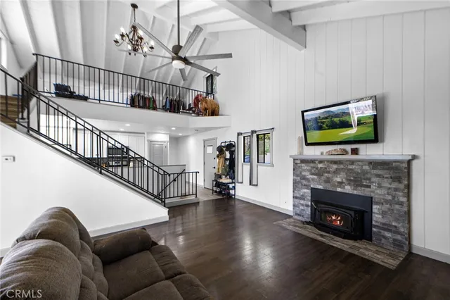 a living room with fireplace furniture and a flat screen tv