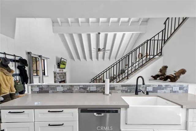 a kitchen with a sink and a refrigerator