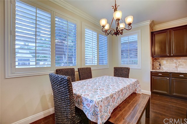 8546 Millpond Place Riverside, CA 92508 - Photo 12 of 60 a bedroom with a large bed and a chandelier