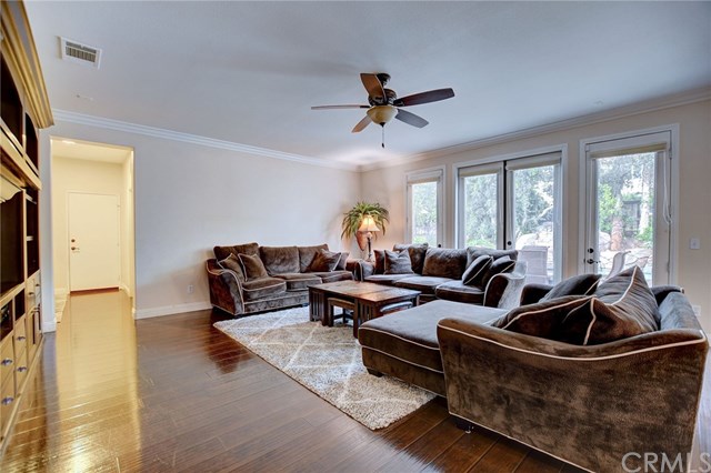 8546 Millpond Place Riverside, CA 92508 - Photo 15 of 60 a living room with furniture and a flat screen tv