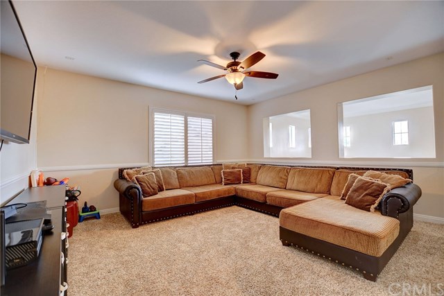 8546 Millpond Place Riverside, CA 92508 - Photo 24 of 60 a living room with furniture and a couch