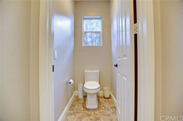 8546 Millpond Place Riverside, CA 92508 - Photo 31 of 60 a bathroom with a toilet and a view of bathroom