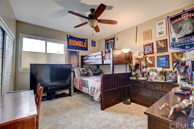 8546 Millpond Place Riverside, CA 92508 - Photo 32 of 60 a living room with furniture and a flat screen tv