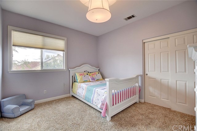 8546 Millpond Place Riverside, CA 92508 - Photo 34 of 60 a bedroom with a bed and window